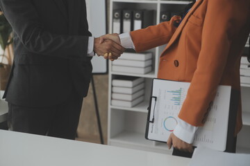 Obraz premium Group of Young Asian business team creative businesspeople coworker in office Happy to be successful partnership teamwork celebrating achievement and success concept.