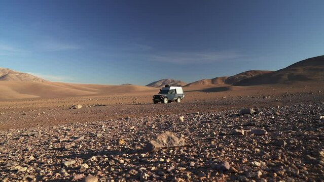 four wheel drive off road vehicle parked in atacama desert