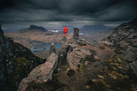 Hiker in the mountains of Coigach and Assynt located in the Northwest of Scotland.