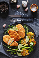 fried chicken breasts with asparagus and potatoes