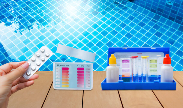 Two type of water tester test kit over clear swimming pool water, best water quality, pool maintenance, good quality Water testing test kit for swimming pool