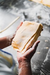 Baker working the bread dough for empanadas - Pastry Making