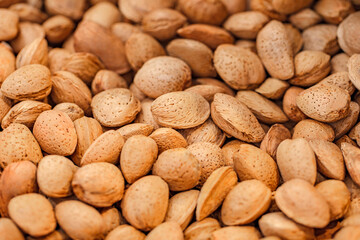 Nuts almonds whole, in bulk, on supermarket, selective focus