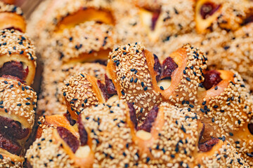 Bakery products baked goods with light and black sesame seeds, selective focus