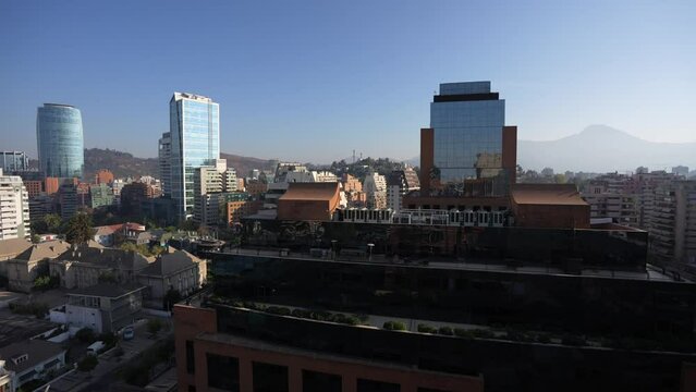 Santiago de Chile from above. 4K video from the middle of the city during a beautiful autumn morning. Travel to Chile. Pan camera movement video.