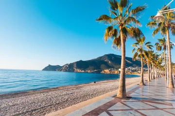 Fotobehang View to beautiful Albir town with main boulevard promenade, seaside beach and Mediterranean sea. Albir is small resort city between Altea and Benidorm, Alicante province, Spain © vejaa