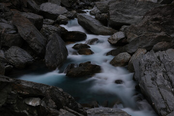 Stream of a river flowing through the rocks