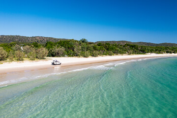 4WD off-road vehicle driving on beach, Moreton Island, Queensland