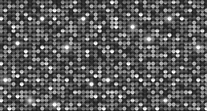 Bright shiny black and white sequins with glitter background
