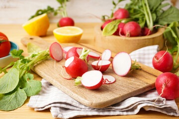 Fresh red radish slices on a wooden background. Close-up.