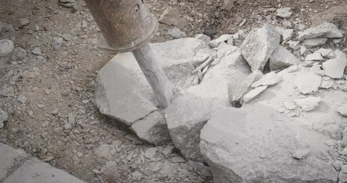 Jackhammer cracking rocks at 120fps