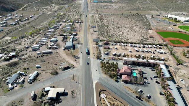 Beatty, Death Valley, California, USA 2023 - Flying around the small town looking at car and truck on the long road towards the mountains