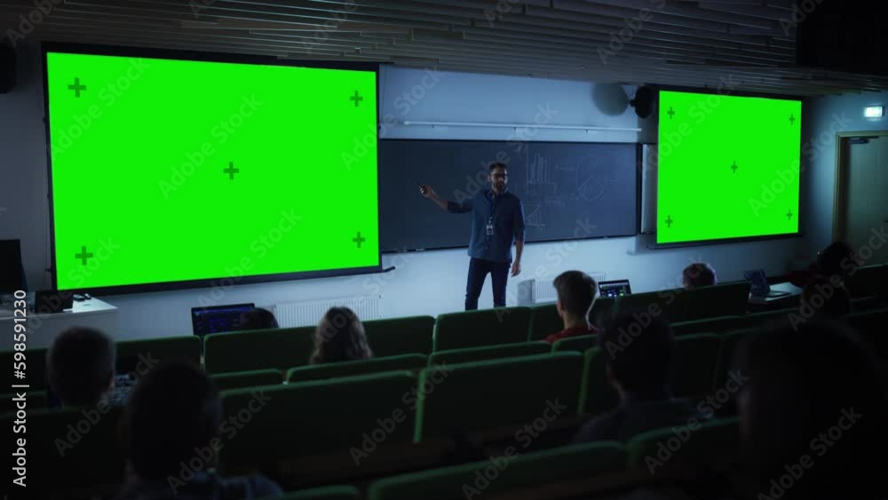 Poster young university professor explaining a lecture, pointing on a green screen mock up display. group o