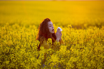 Woman having allergy reaction in blooming field