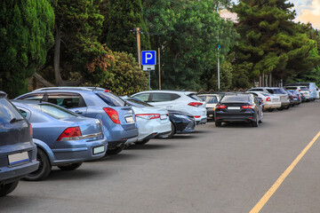 Cars in the parking lot in the city near the square
