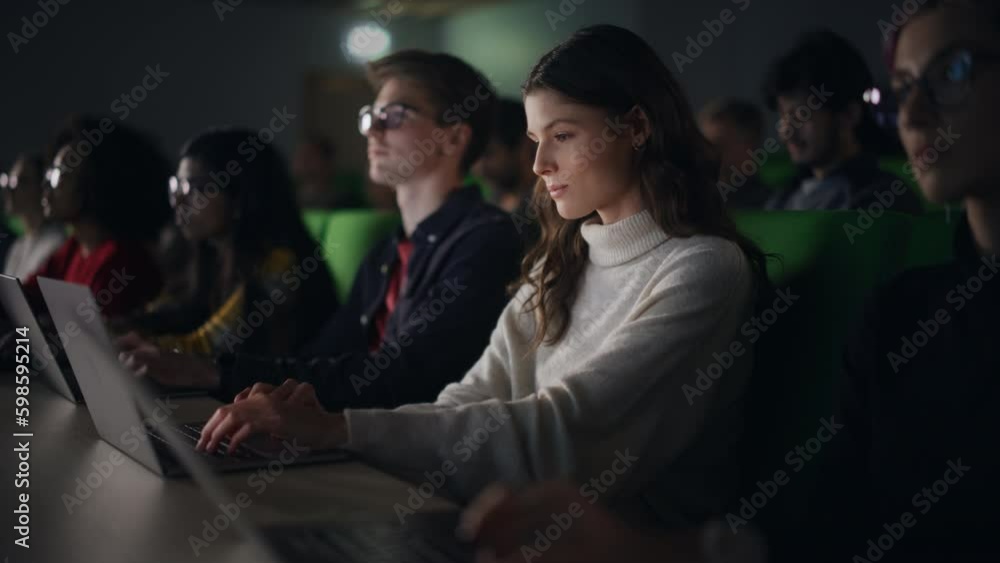 Poster Beautiful Smart Female Student Studying in University with Diverse Multiethnic Classmates. She is Using a Laptop Computer. Applying Her Knowledge to Acquire Academic Skills in Class