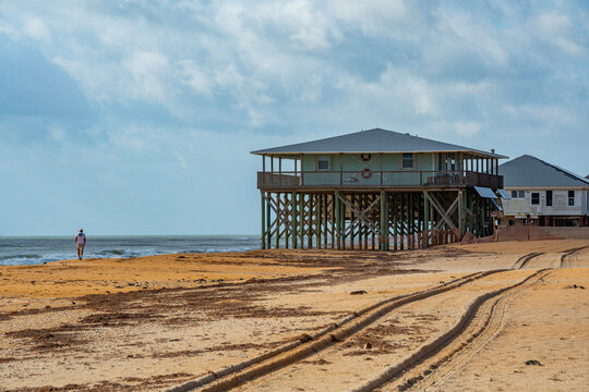 Base of house raised on stilts damaged by hurricane