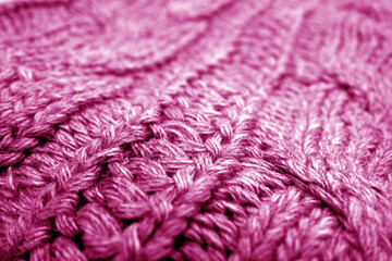 Warm knitting texture with blur effect in pink tone.