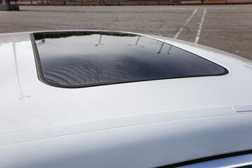 Lviv, Ukraine - May 19, 2018. Top view transparent sunroof in white new Porsche