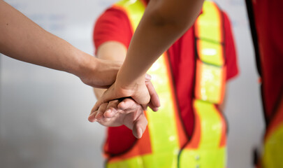 Warehouse teamwork person holding hands strength collaboration concept. Business partnership success together team. Group of people unity friendship, circle partnership connection.