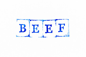Blue color ink rubber stamp in word beef on white paper background