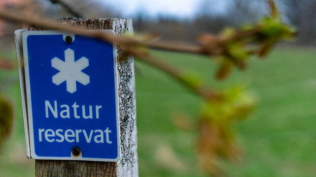 Nature Reserve Teleborg in Vaxjo, Sweden. "Natur reservat" sign, nature conservation area signpost.