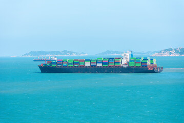 Cargo container ship anchored near Chinese sea coast.