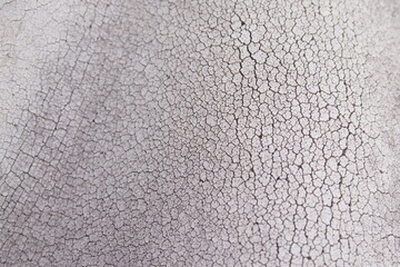 Cracked plastic material texture. The plastic is destroyed by the heat.