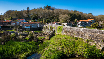 A Ponte Maceira, Galicia, Spain - April 4, 2023: Roman stone bridge over the River Tambre