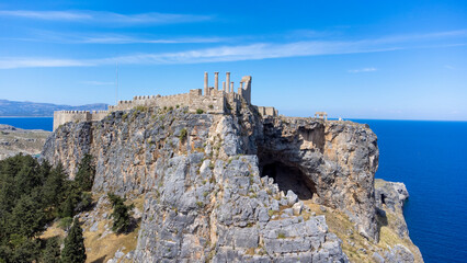 The Acropolis of Lindos in Rhodes island Greece. Saint Paul's Beach and Lindos Acropolis aerial panoramic view.