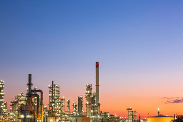 Twilight scene of tank oil refinery plant and tower column of Petrochemistry