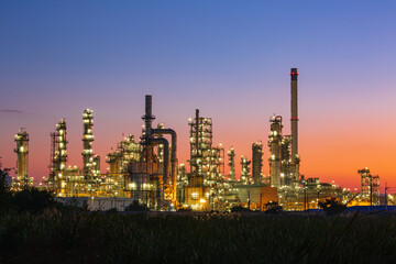 Fototapeta na wymiar Twilight scene of tank oil refinery plant and tower column of Petrochemistry