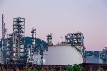Twilight scene of tank oil refinery plant and tower column of Petrochemistry industry