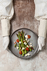 Grilled asparagus with goat cheese and tomatoes