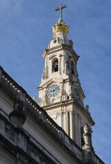 Fatima, Portugal - March 29, 2023: The Sanctuary of Fatima (or Sanctuary of Our Lady of the Rosary of Fatima) is a Marian shrine dedicated to Our Lady of Fatima. Sunny spring day. Selective focus