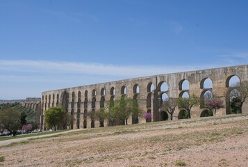 Elvas, Portugal - March 30, 2023: Wonderful landscapes in Portugal. Beautiful scenery of Amoreira Aqueduct in Elvas. 16th-century aqueduct. It brings water into the fortified seat. Selective focus