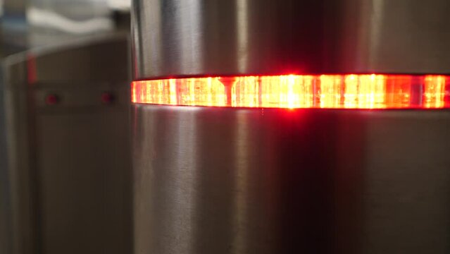 red light on submay turnstile, close-up. turnstile gate in the background