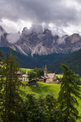 Fototapeta na wymiar panoramic view of the dolomites in val di funes, the Odle with the village of Santa Maddalena below, Italy