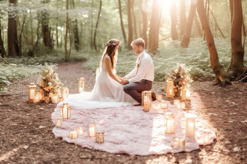 Whimsical woodland micro wedding with the bride and groom surrounded by towering trees and twinkling fairy lights