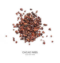 Creative layout made of cacao nibs on white background. Flat lay. Food concept. Macro  concept.