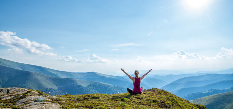 Young woman on the top of mountain © nickolya