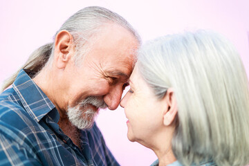 Happy senior having tender moment - Elderly family love concept - Focus on man nose