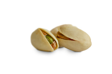 Several ripe pistachios isolated on a white background.