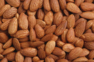 Pattern Organic almond nut raw peeled as background, top view. Healthy snack or for vegetarians. copy space banner.