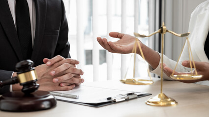 Lawyer are advising with client about legal litigation.