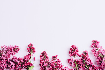 Lilac flowers on light background. Easter, Mother's day, Women's day, Valentine's day greeting card. Top view, flat lay, copy space