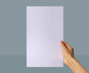 Realistic hand holding US legal paper mockup. Portrait US legal size mockup. Simple, clean, modern, minimal poster mock up. Paper mockup in hand
