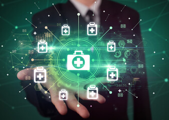 Hand holding healthcare icons concept