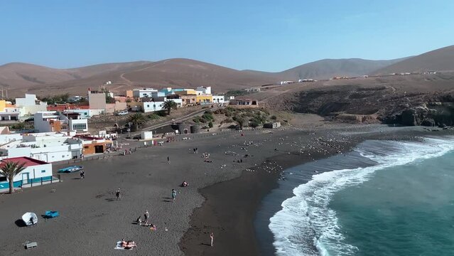 Overview of Ajuy black sandy beach from the coast path 