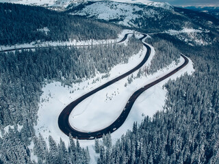 winter road from drone view - obrazy, fototapety, plakaty